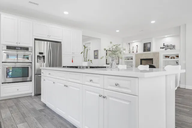 a living room with fireplace furniture and decor