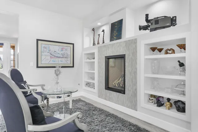 a living room with furniture and a painting