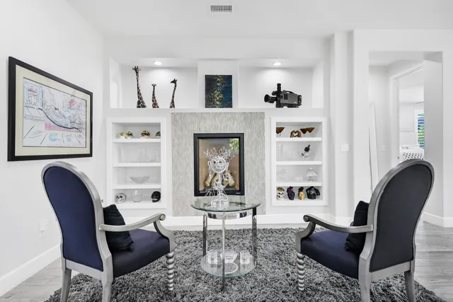 a spacious bedroom with a bed and a large window