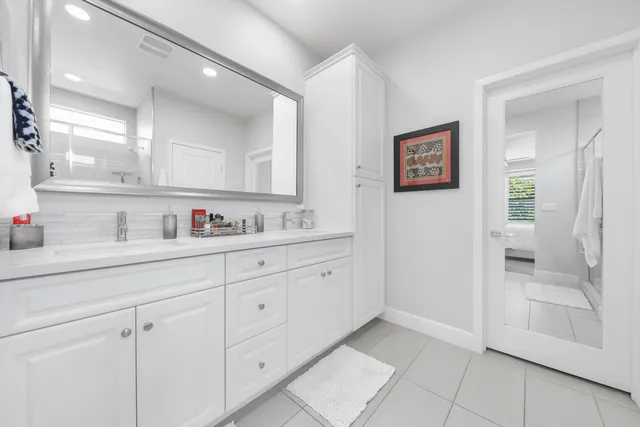 a bathroom with a glass shower door