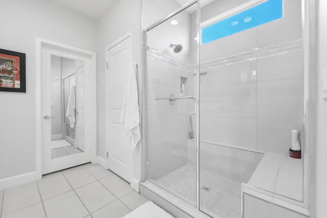 a view of walk in closet with clothes