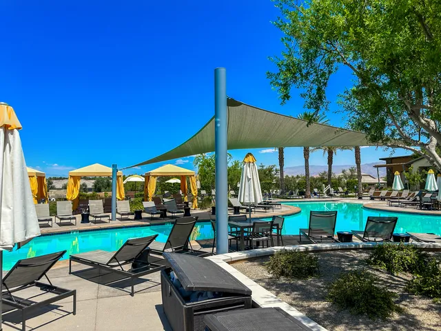 a view of a swimming pool with a patio