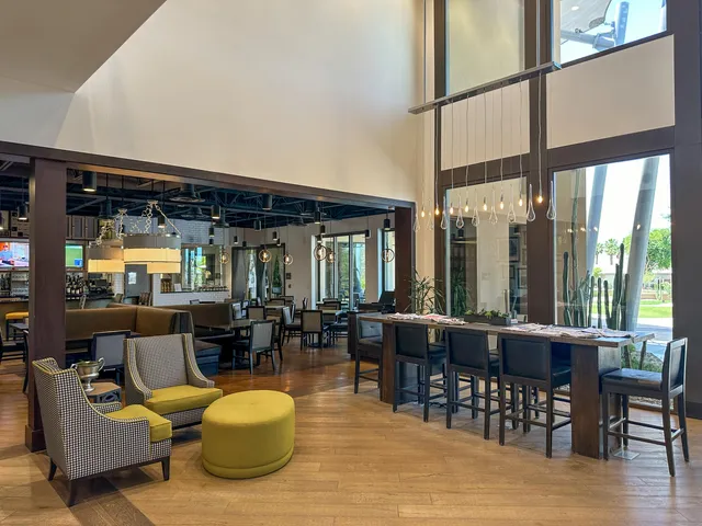 a view of a swimming pool with outdoor seating