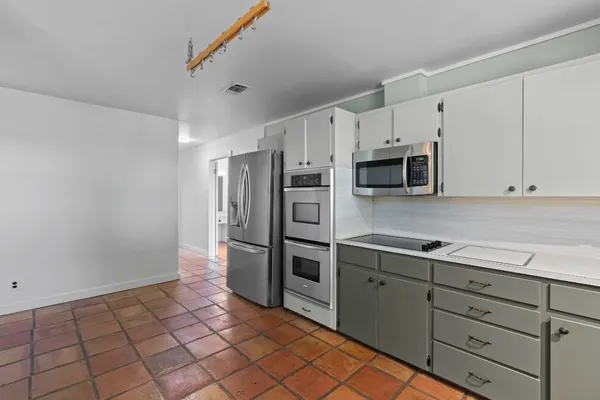 a spacious bathroom with a double vanity sink mirror and