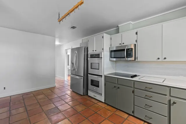 a spacious bathroom with a double vanity sink mirror and