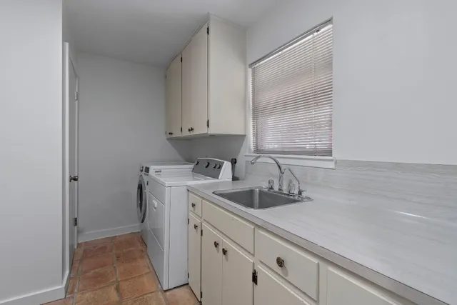 a kitchen with stainless steel appliances a refrigerator sink and microwave