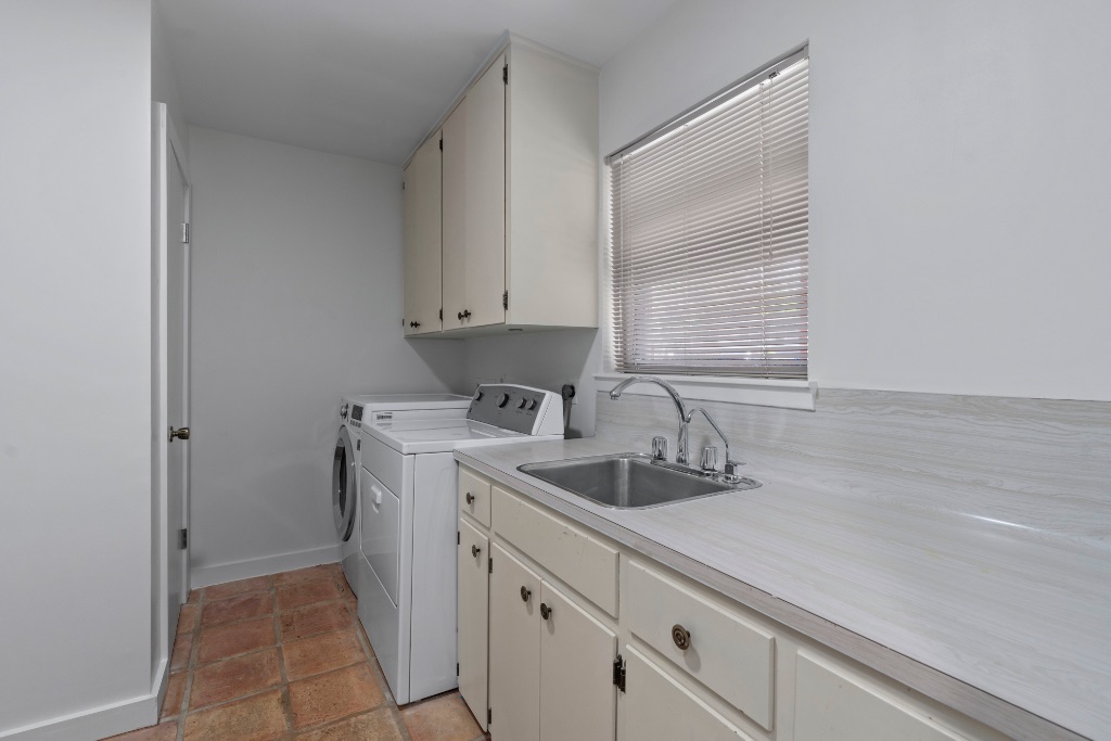 103 Comet Lakeway, TX 78734 - Photo 11 of 38 a kitchen with a sink and cabinets