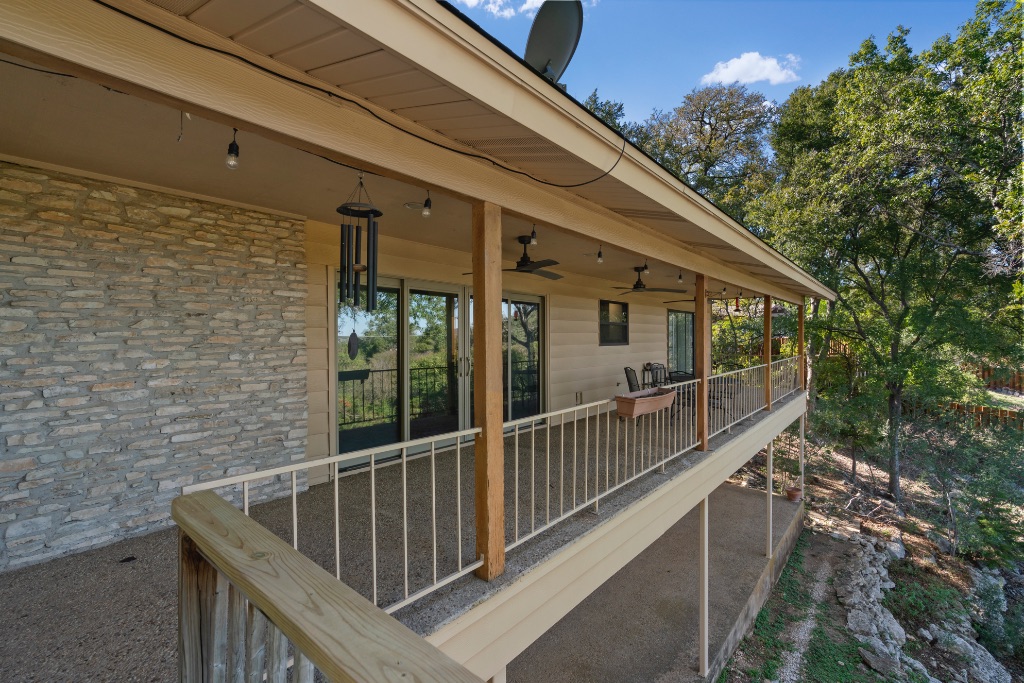 103 Comet Lakeway, TX 78734 - Photo 30 of 38 a view of balcony with wooden floor and fence