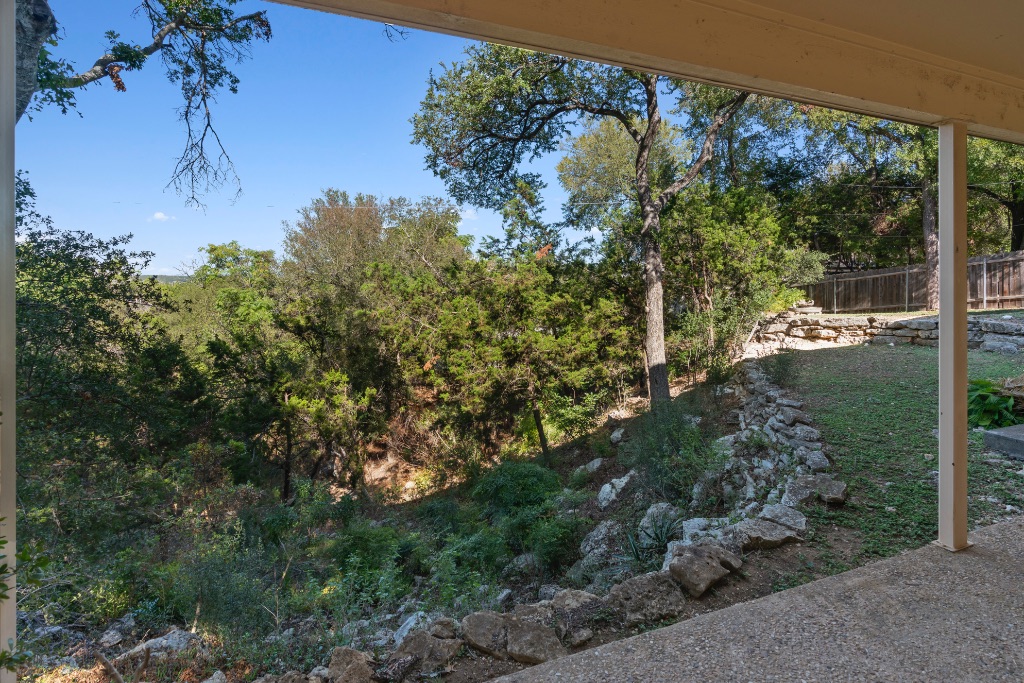 103 Comet Lakeway, TX 78734 - Photo 35 of 38 a view of a garden with a tree