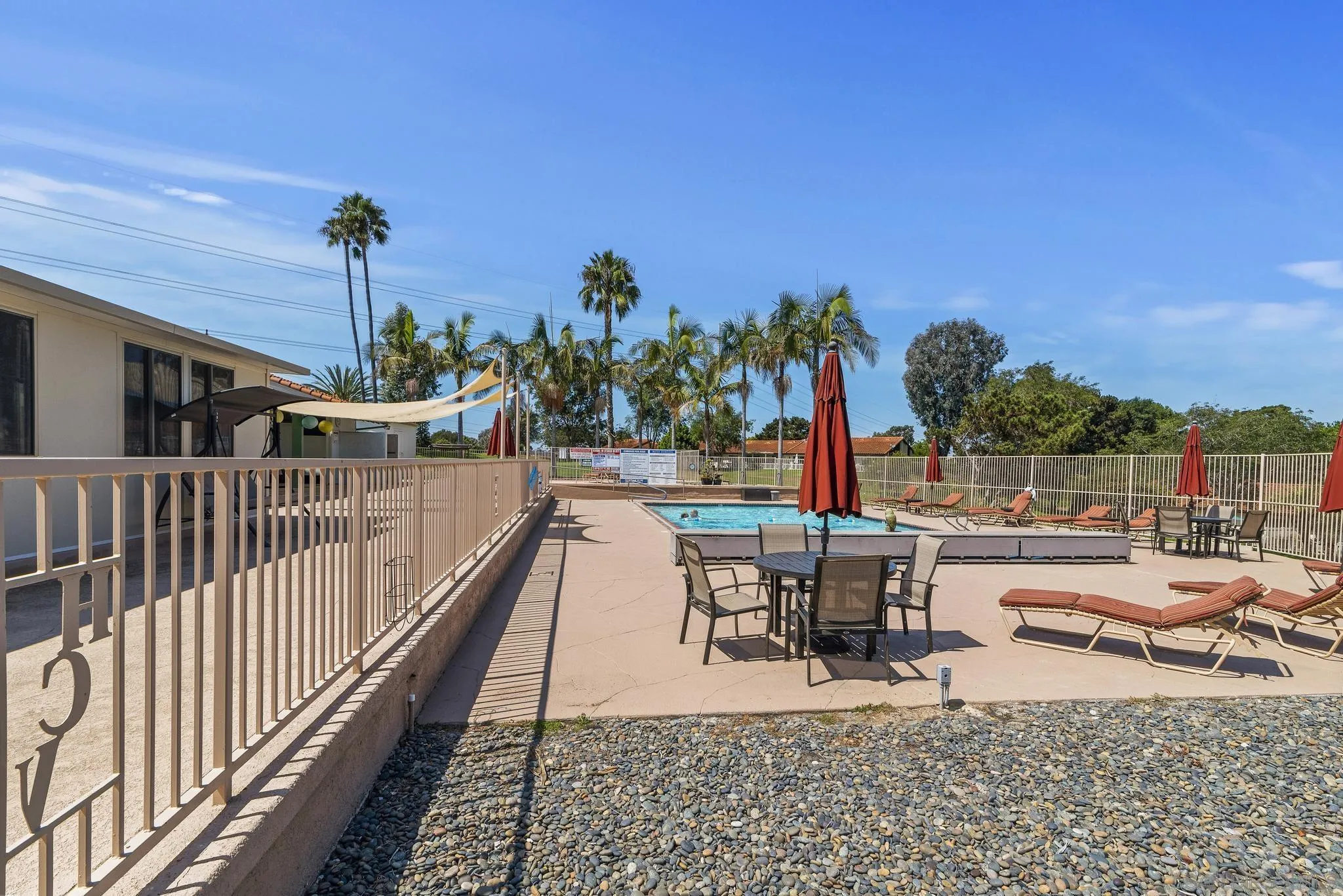 354 Abington Road Encinitas, CA 92024 - Photo 33 of 35 a view of a swimming pool with outdoor seating and plants