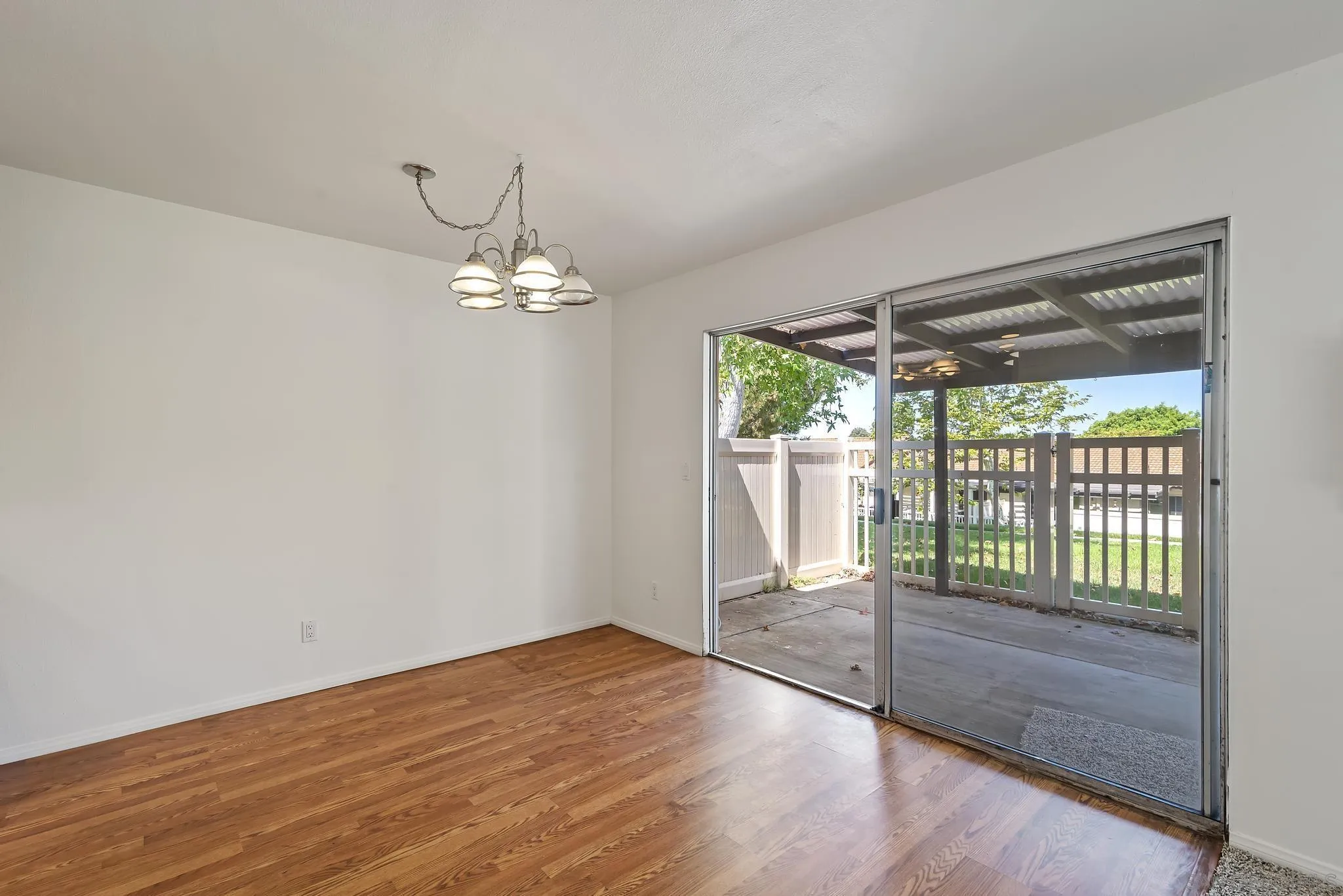 354 Abington Road Encinitas, CA 92024 - Photo 7 of 35 a view of a livingroom with wooden floor and a large window