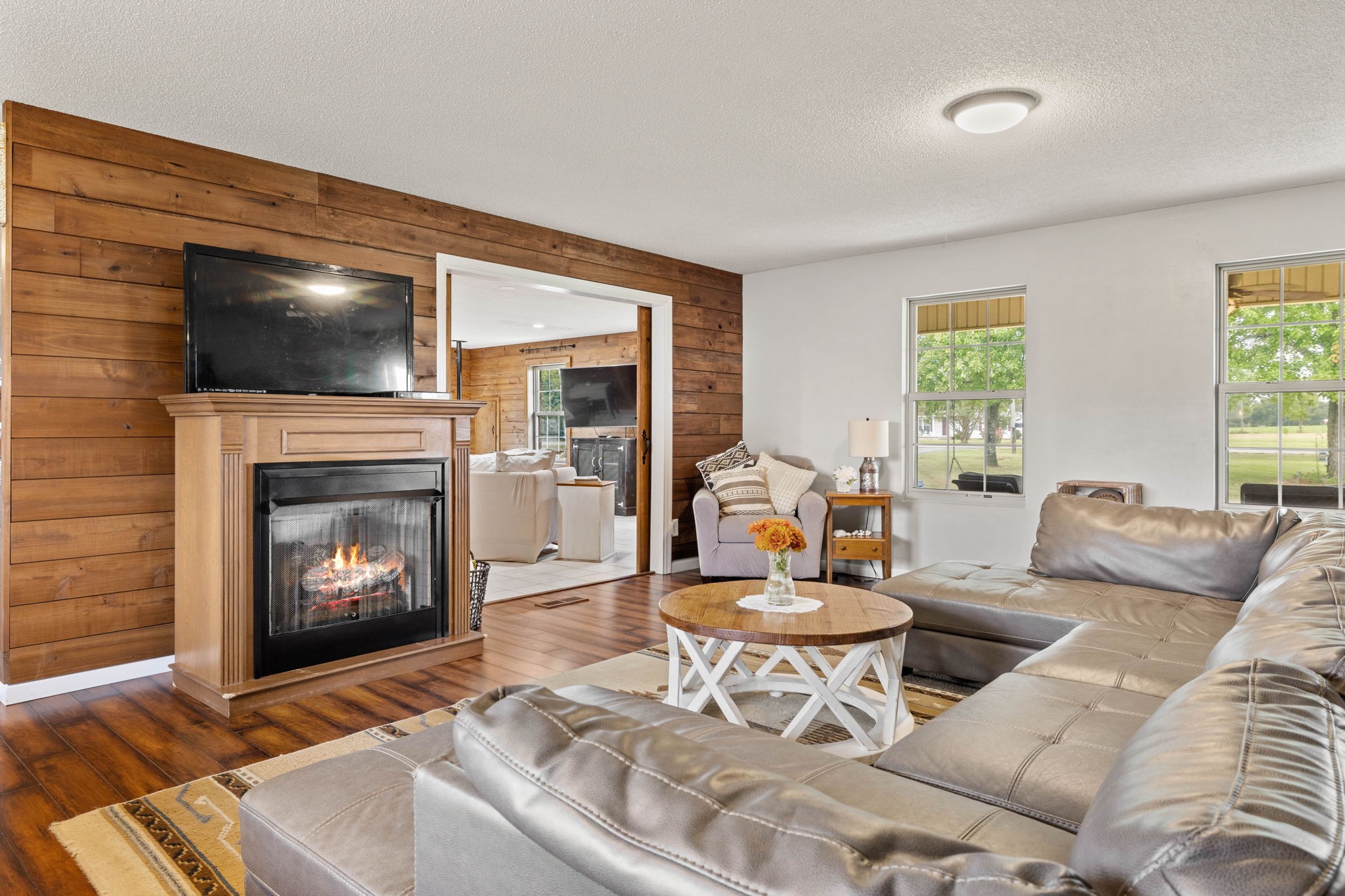 1146 Longview Road Unionville, TN 37180 - Photo 11 of 55 a living room with furniture a flat screen tv and a fireplace
