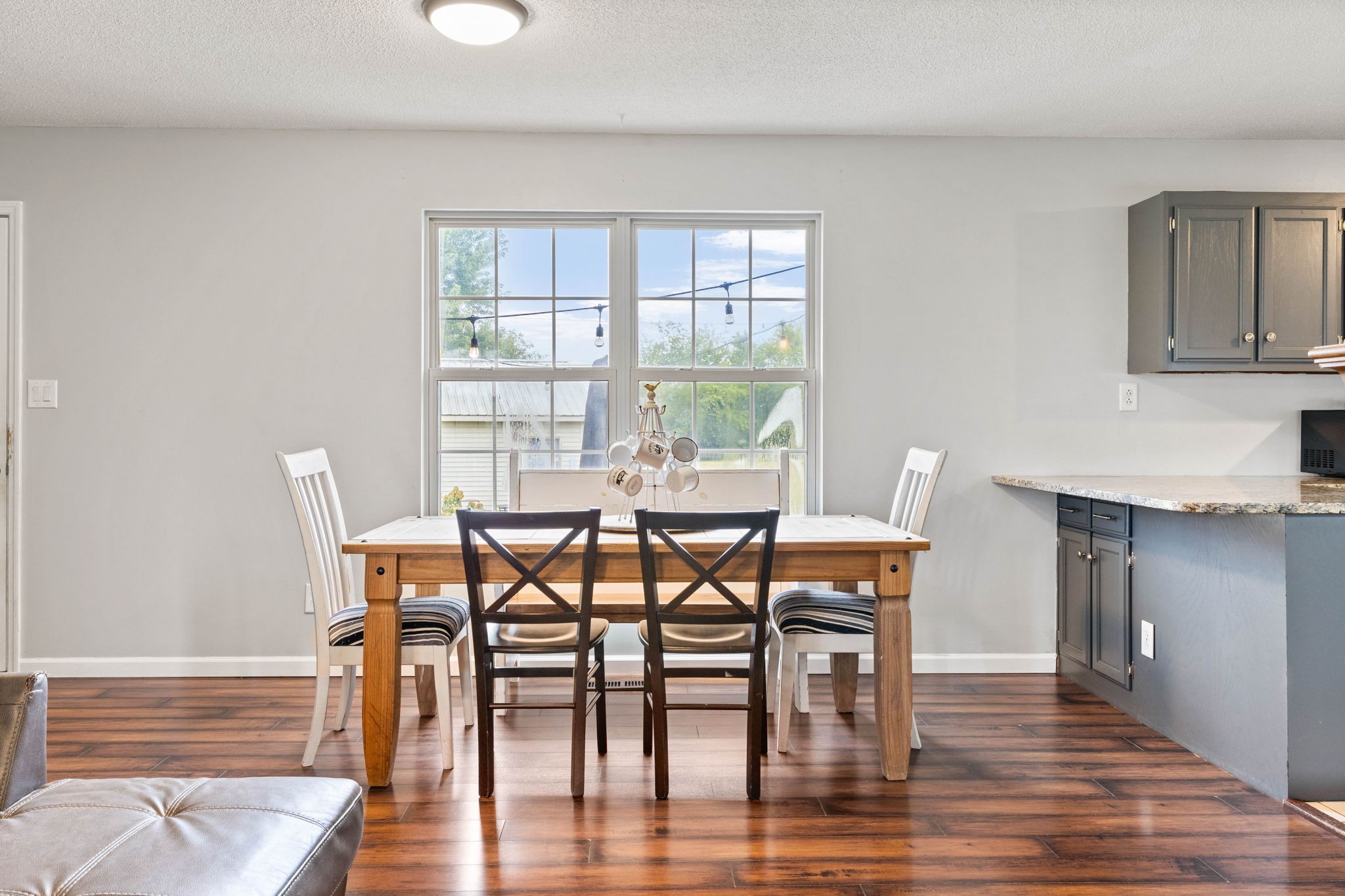 1146 Longview Road Unionville, TN 37180 - Photo 15 of 55 a dining room with furniture and wooden floor