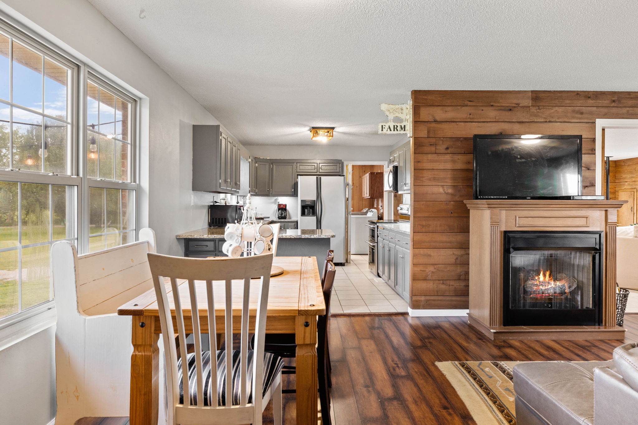 1146 Longview Road Unionville, TN 37180 - Photo 17 of 55 a living room with furniture a flat screen tv and a fireplace