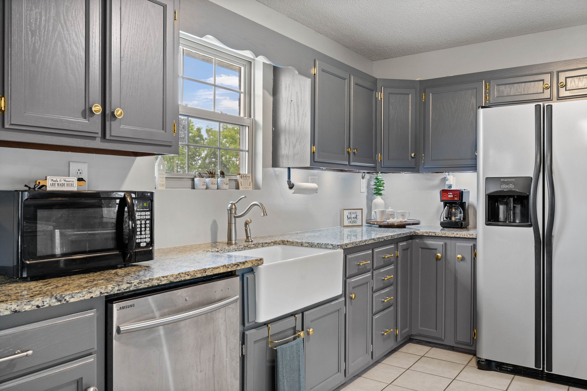 1146 Longview Road Unionville, TN 37180 - Photo 19 of 55 a kitchen with stainless steel appliances granite countertop a sink stove and refrigerator