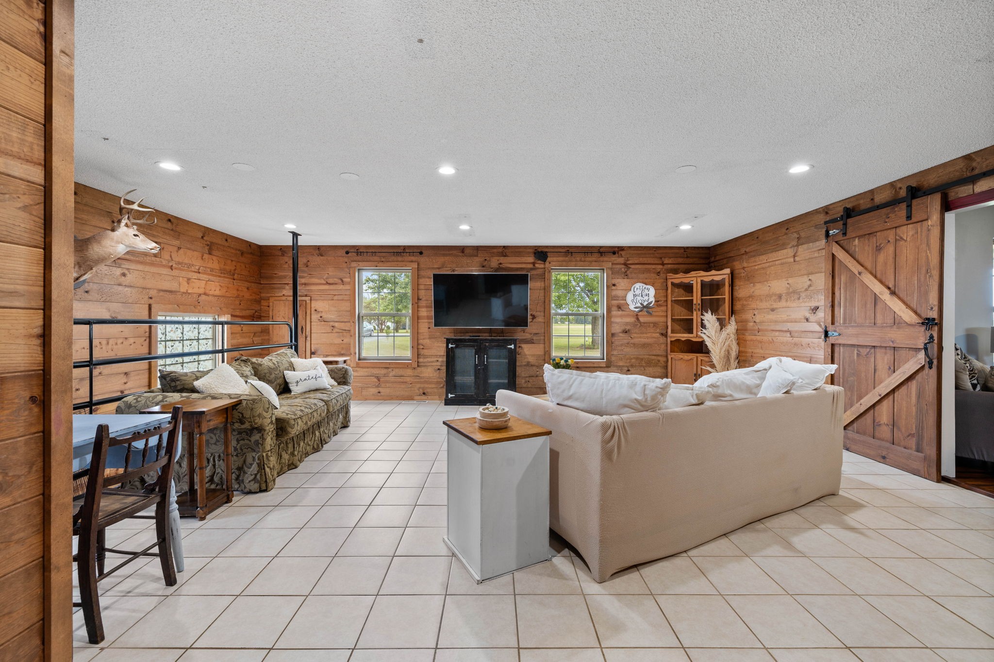 1146 Longview Road Unionville, TN 37180 - Photo 22 of 55 a living room with furniture a fireplace and a flat screen tv
