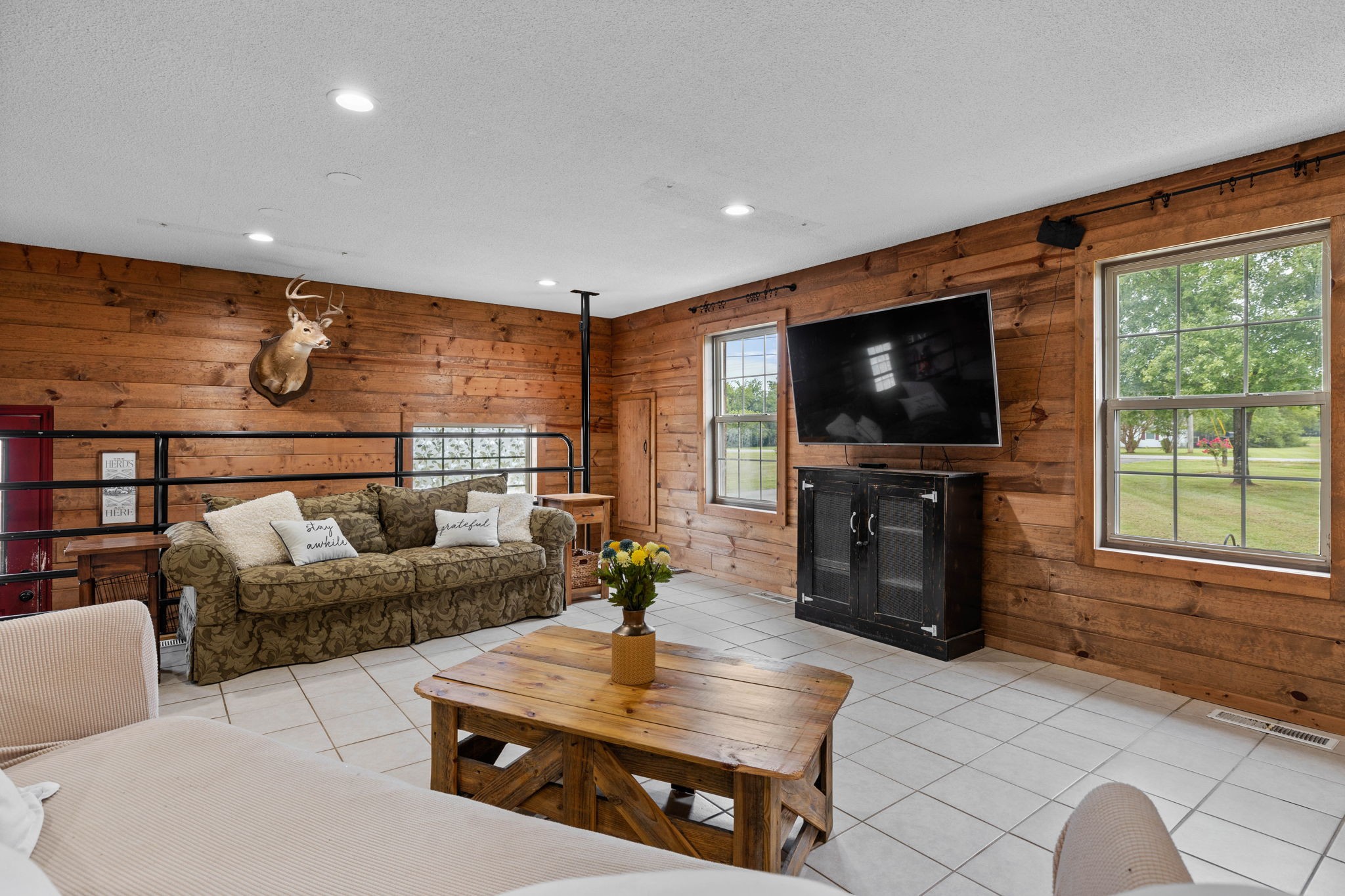 1146 Longview Road Unionville, TN 37180 - Photo 24 of 55 a living room with furniture and a flat screen tv