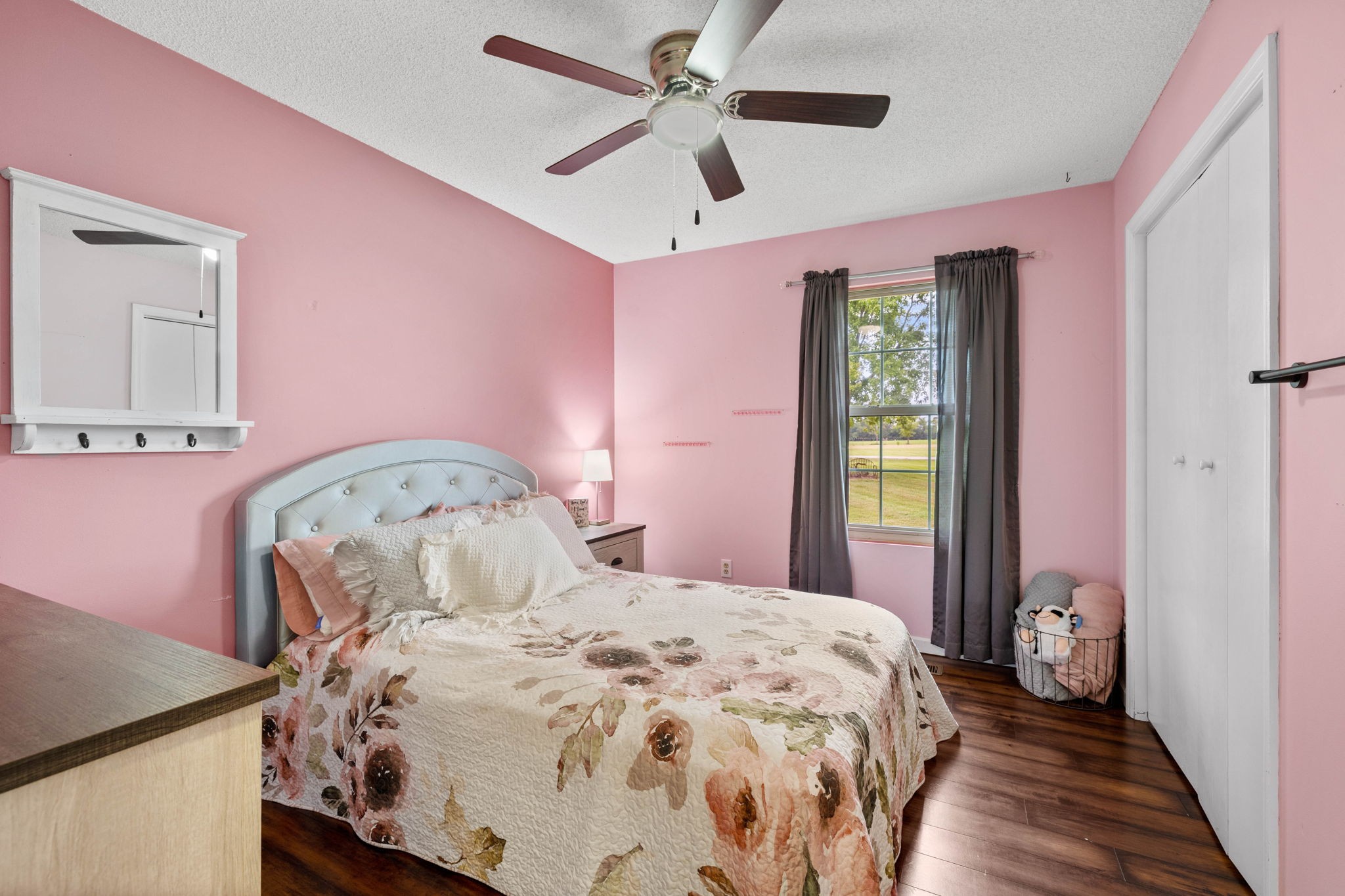 1146 Longview Road Unionville, TN 37180 - Photo 29 of 55 a bedroom with a bed and a chandelier