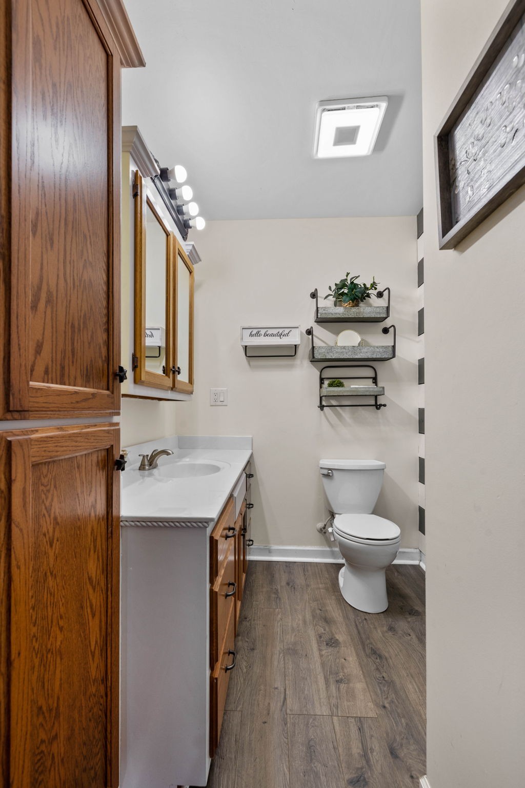 1146 Longview Road Unionville, TN 37180 - Photo 33 of 55 a bathroom with a toilet sink and mirror