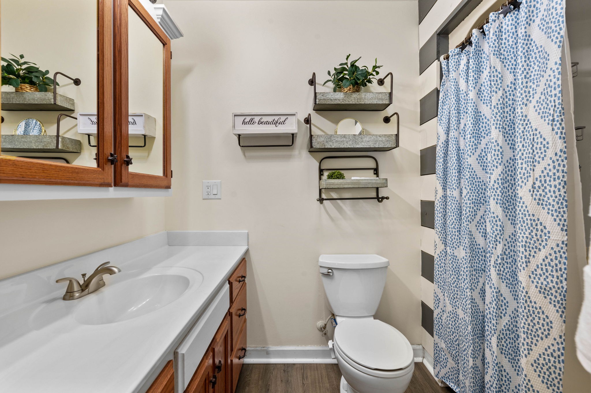 1146 Longview Road Unionville, TN 37180 - Photo 34 of 55 a bathroom with a toilet sink and mirror