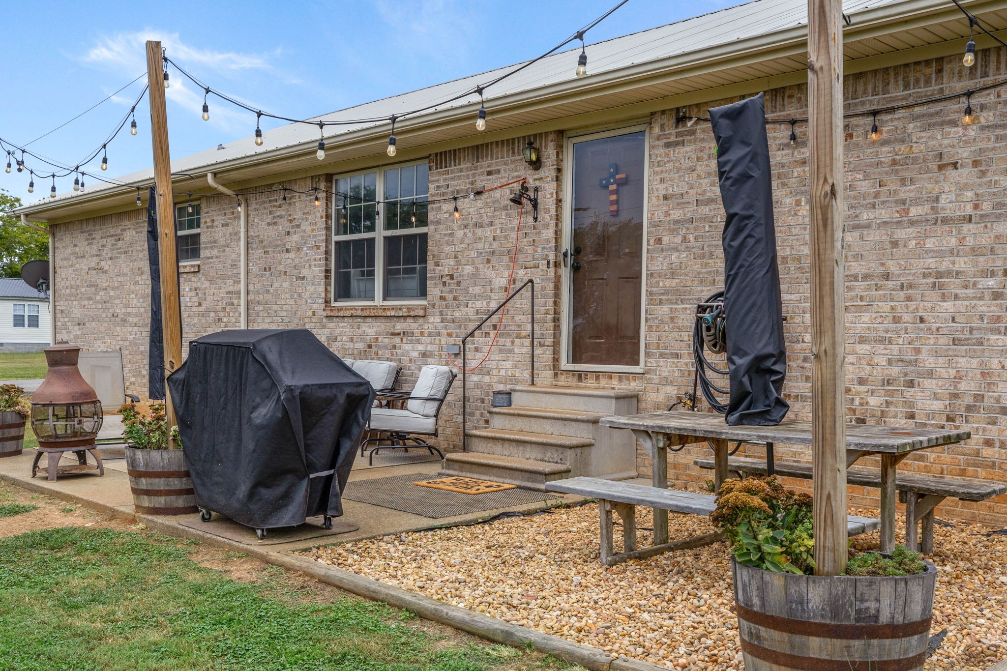 1146 Longview Road Unionville, TN 37180 - Photo 39 of 55 a view of a house with a yard and sitting area
