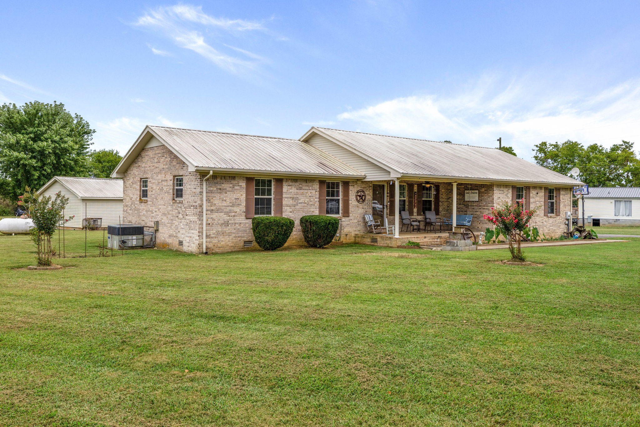 1146 Longview Road Unionville, TN 37180 - Photo 4 of 55 a front view of a house with a garden