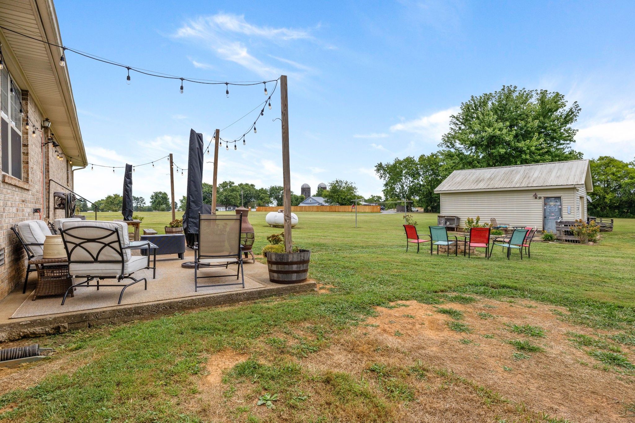 1146 Longview Road Unionville, TN 37180 - Photo 41 of 55 a view of a house with backyard sitting area and garden