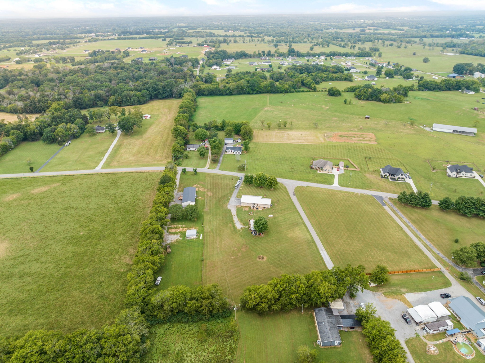 1146 Longview Road Unionville, TN 37180 - Photo 49 of 55 an aerial view of a city with a lake