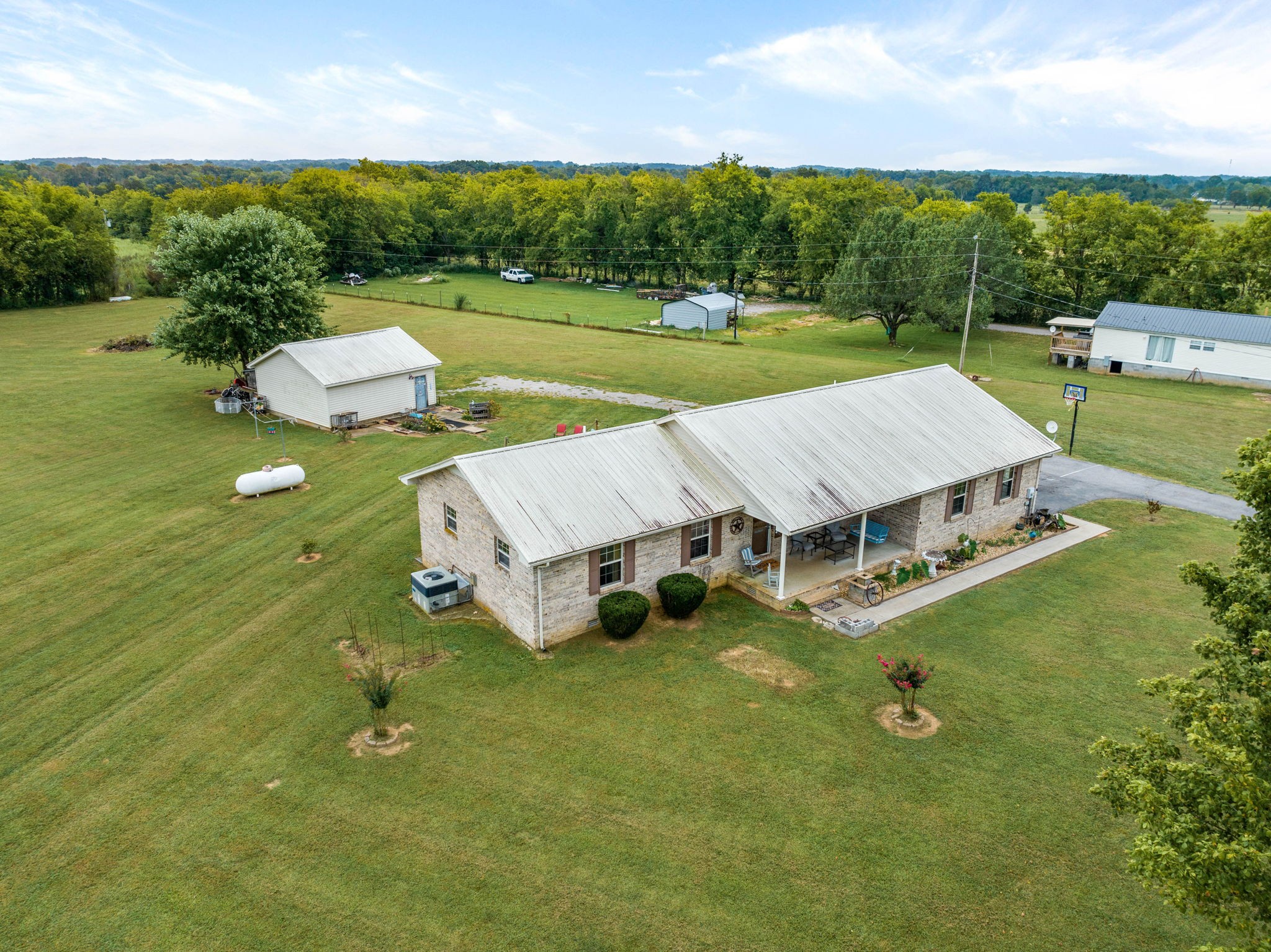 1146 Longview Road Unionville, TN 37180 - Photo 52 of 55 an aerial view of a house with swimming pool garden and outdoor seating