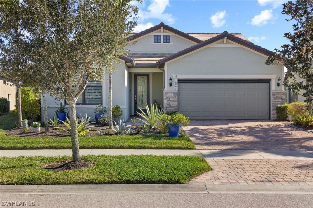 10845 Dennington Road Fort Myers, FL 33913 - Photo 1 of 46 a front view of a house with a yard