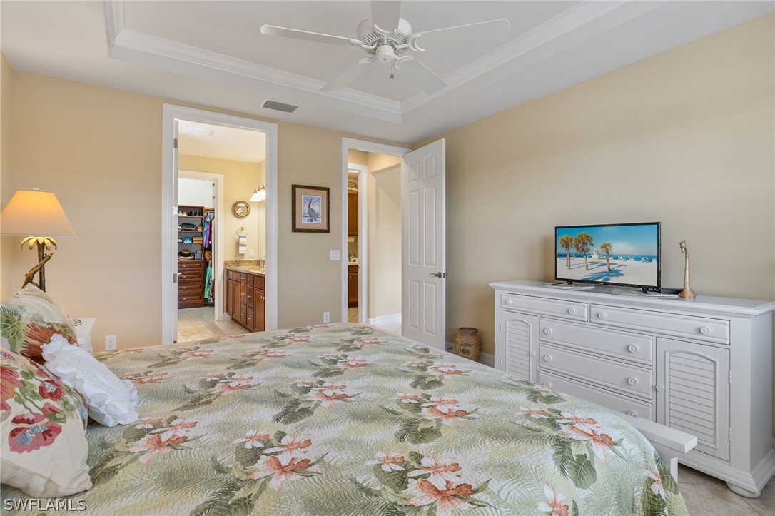10845 Dennington Road Fort Myers, FL 33913 - Photo 11 of 46 a bedroom with a bed and a dresser in it