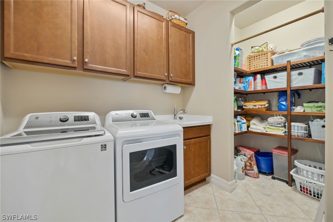 10845 Dennington Road Fort Myers, FL 33913 - Photo 16 of 46 a utility room with dryer and washer