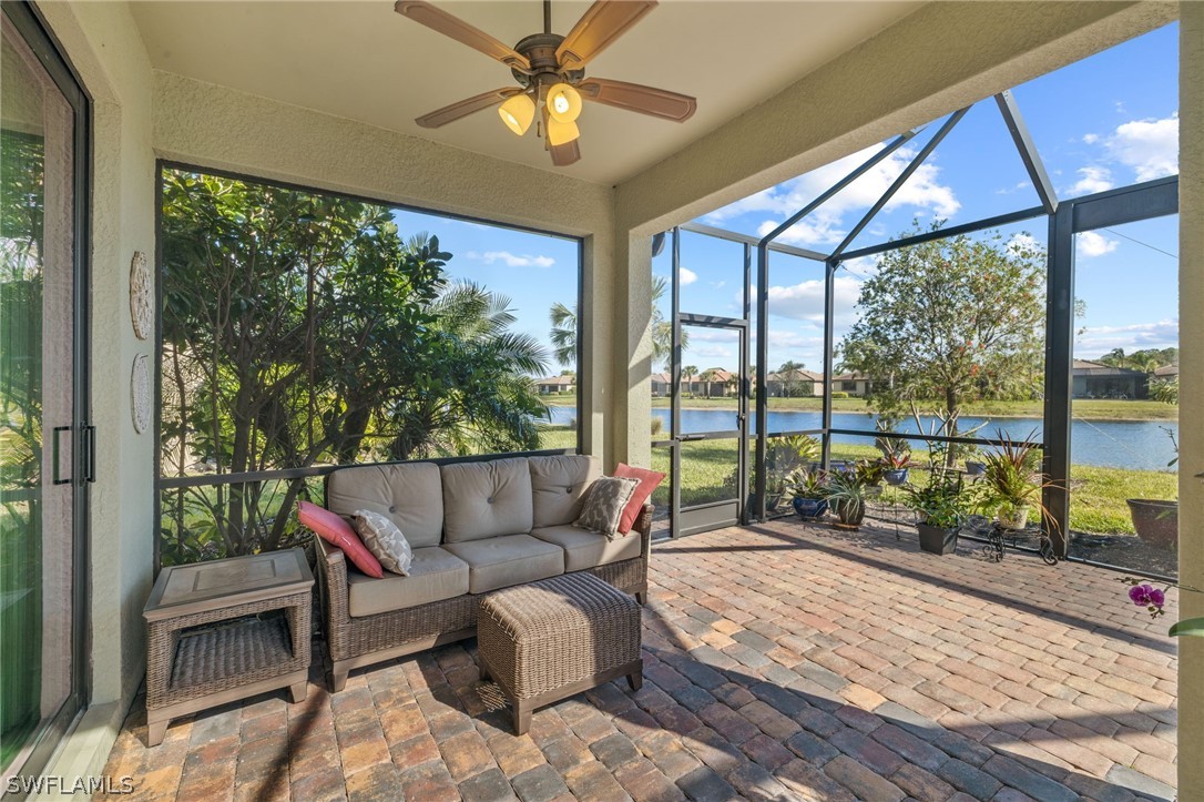10845 Dennington Road Fort Myers, FL 33913 - Photo 18 of 46 a living room with furniture and a floor to ceiling window
