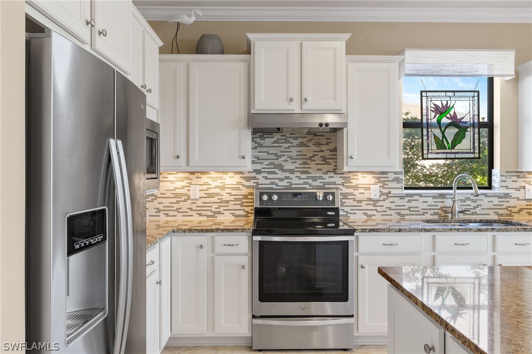10845 Dennington Road Fort Myers, FL 33913 - Photo 24 of 46 a kitchen with stainless steel appliances granite countertop a refrigerator and a stove