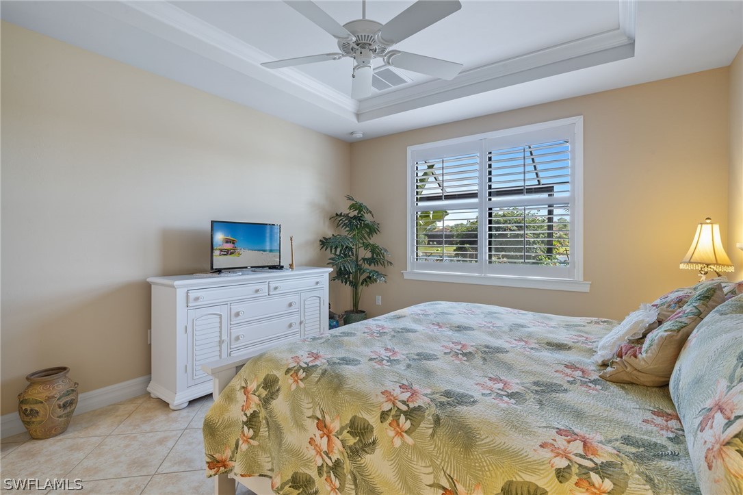 10845 Dennington Road Fort Myers, FL 33913 - Photo 25 of 46 a bedroom with a bed and a dresser