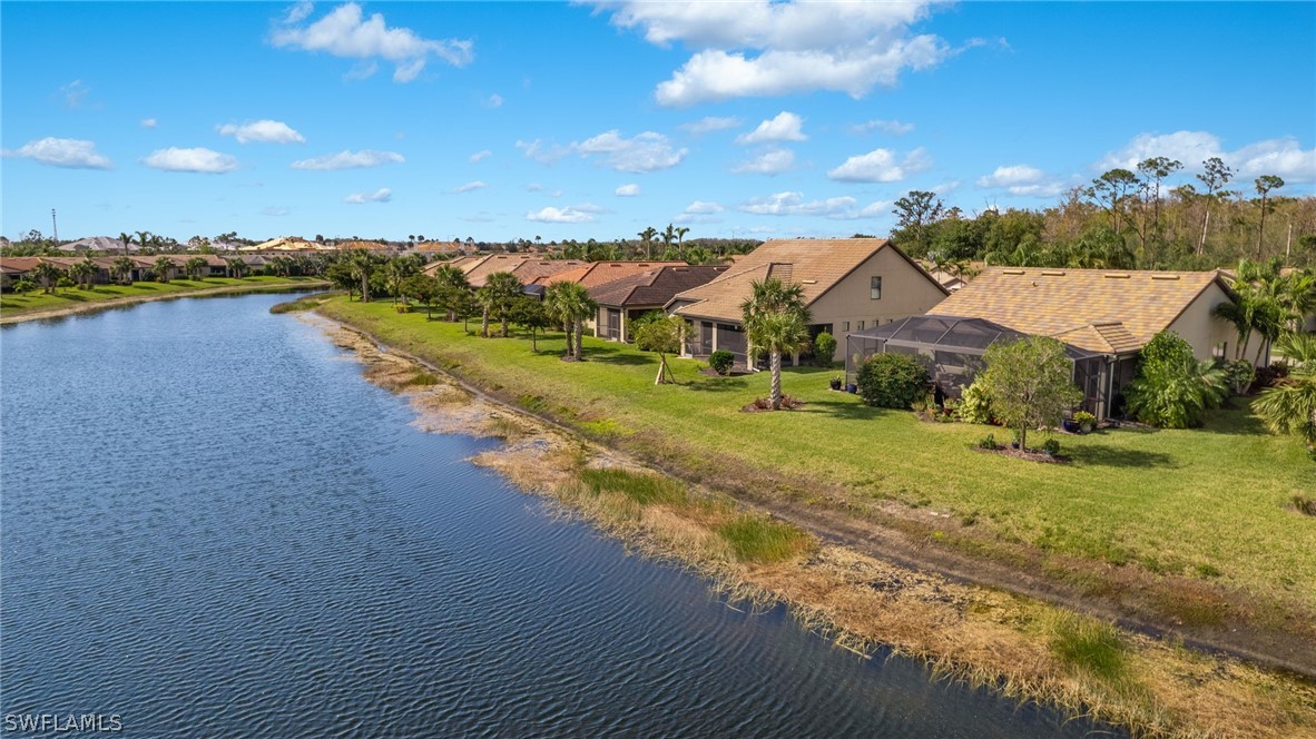 10845 Dennington Road Fort Myers, FL 33913 - Photo 32 of 46 a view of a lake with houses in the back