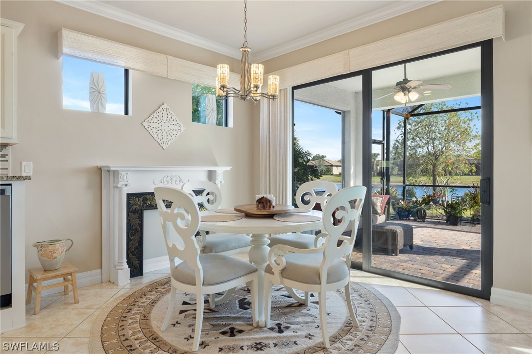 10845 Dennington Road Fort Myers, FL 33913 - Photo 8 of 46 a dining room with furniture a chandelier and window