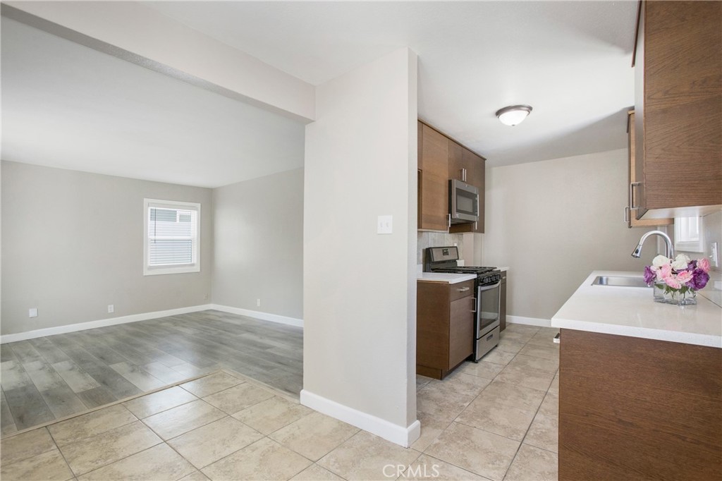 634 Willow Drive Brea, CA 92821 - Photo 5 of 26 a kitchen with a sink cabinets and stainless steel appliances