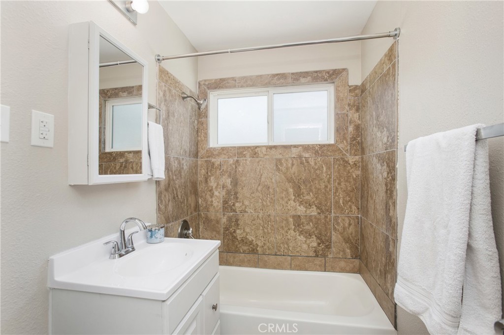 634 Willow Drive Brea, CA 92821 - Photo 10 of 26 a bathroom with a sink a mirror and a bathtub