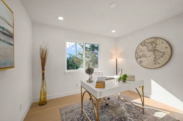 a workspace with furniture and window