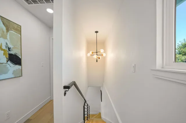 a view of a hallway with windows