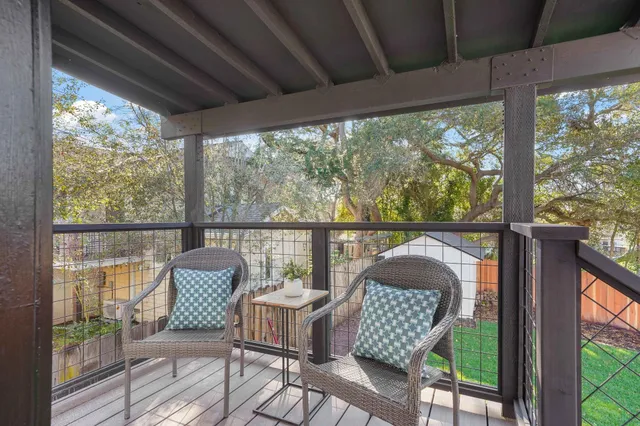 a view of a chair and table in balcony