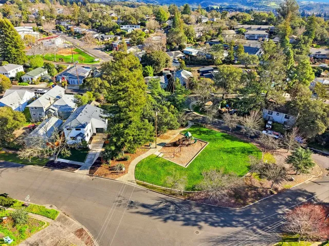 an aerial view of residential houses with outdoor space