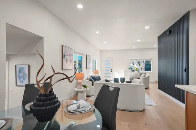 a living room with furniture and a lamp