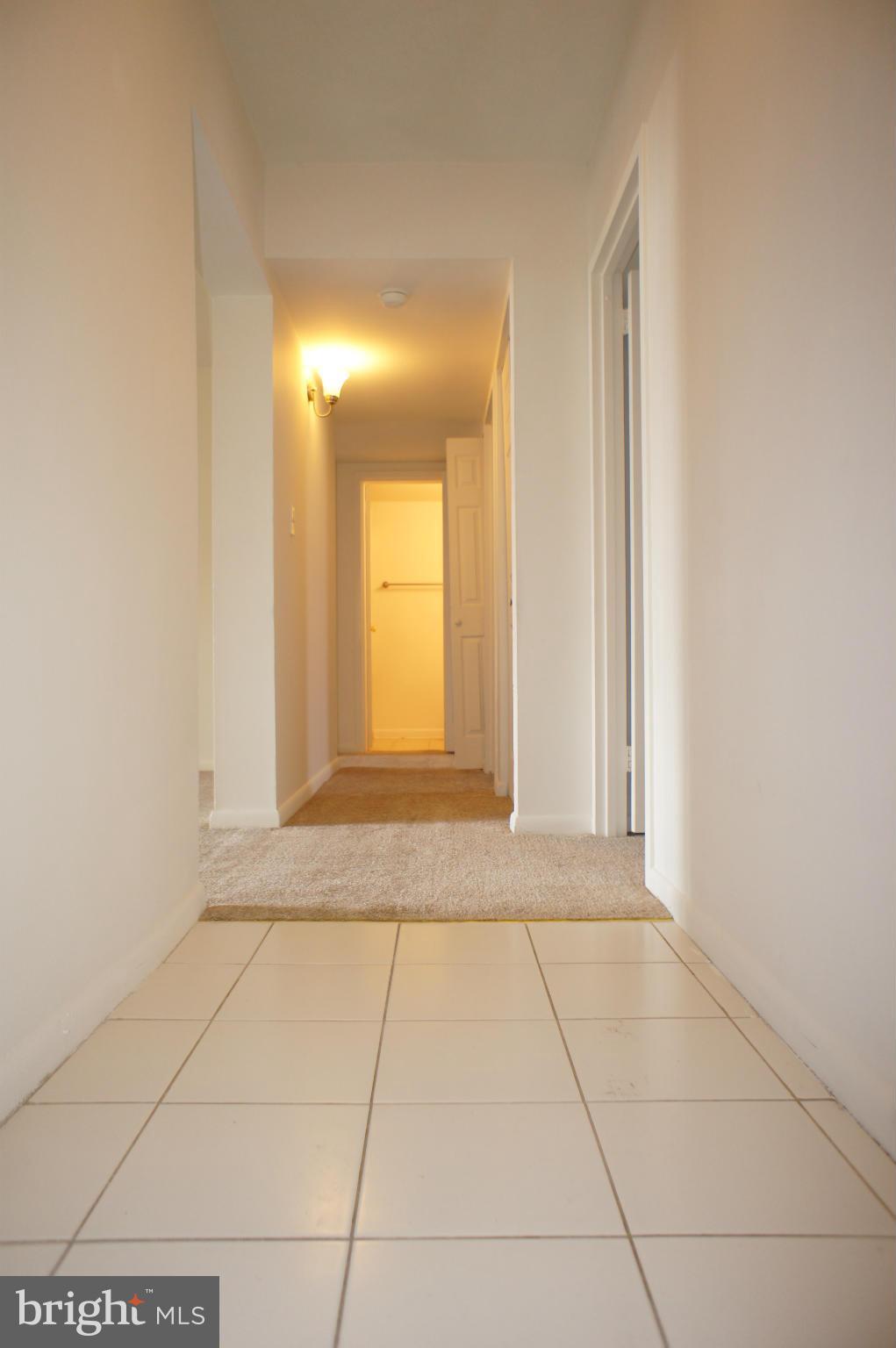 2220 Castle Rock Square, Unit 12C Reston, VA 20191 - Photo 2 of 16 a view of an empty room with window and bathroom