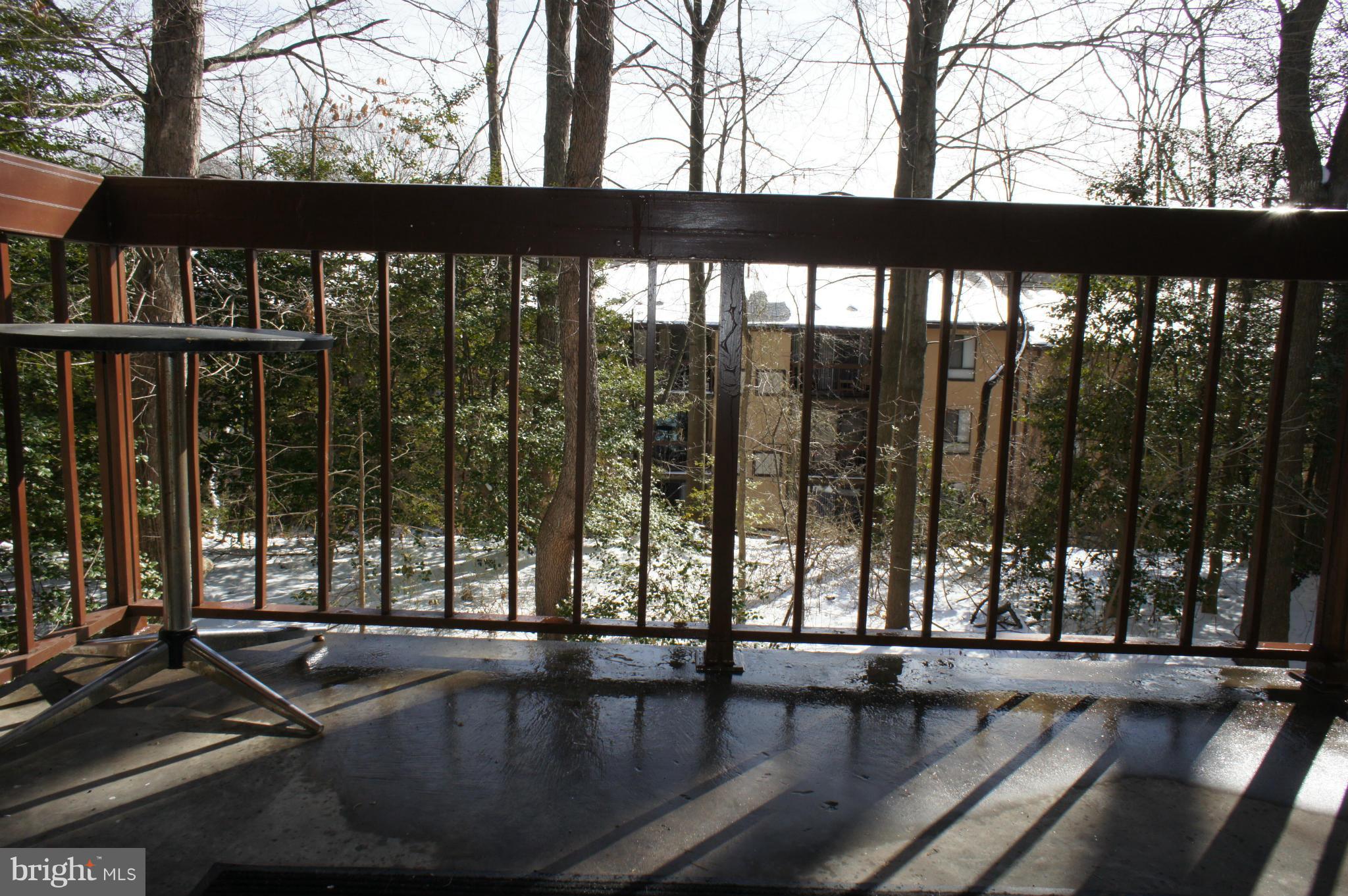 2220 Castle Rock Square, Unit 12C Reston, VA 20191 - Photo 13 of 16 a living room with hardwood floor and large windows