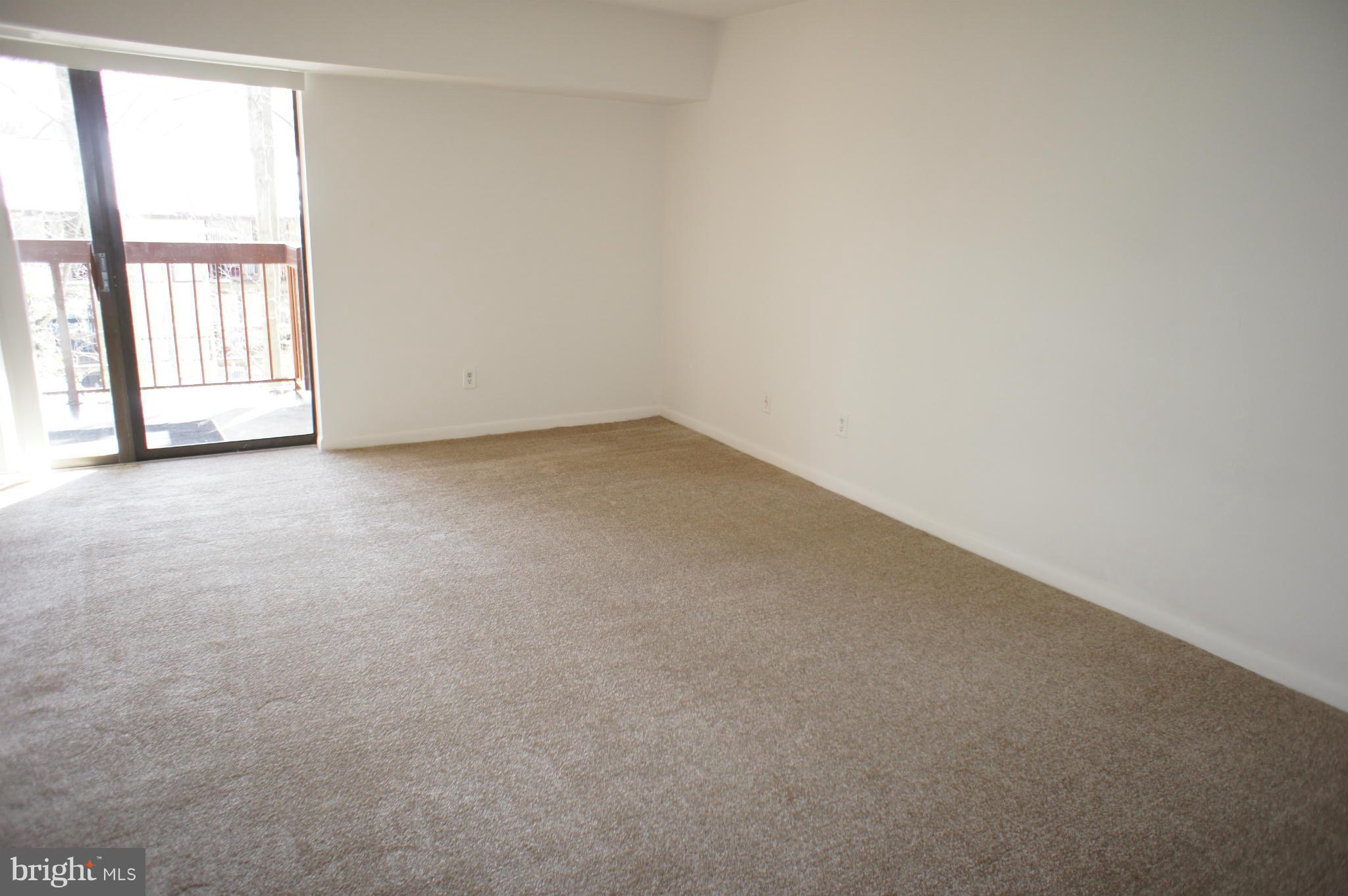 2220 Castle Rock Square, Unit 12C Reston, VA 20191 - Photo 5 of 16 an empty room with a window