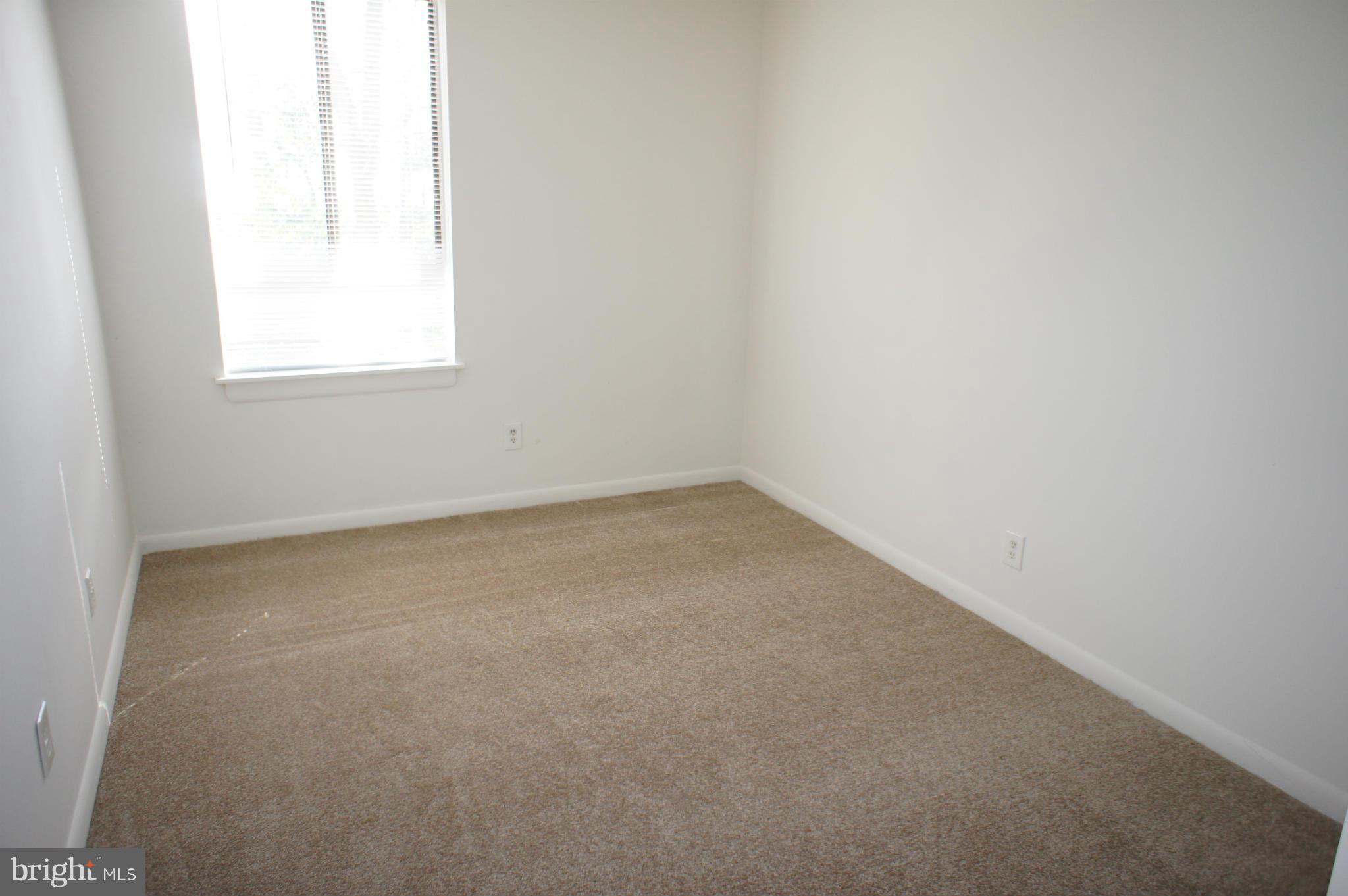 2220 Castle Rock Square, Unit 12C Reston, VA 20191 - Photo 7 of 16 an empty room with a window