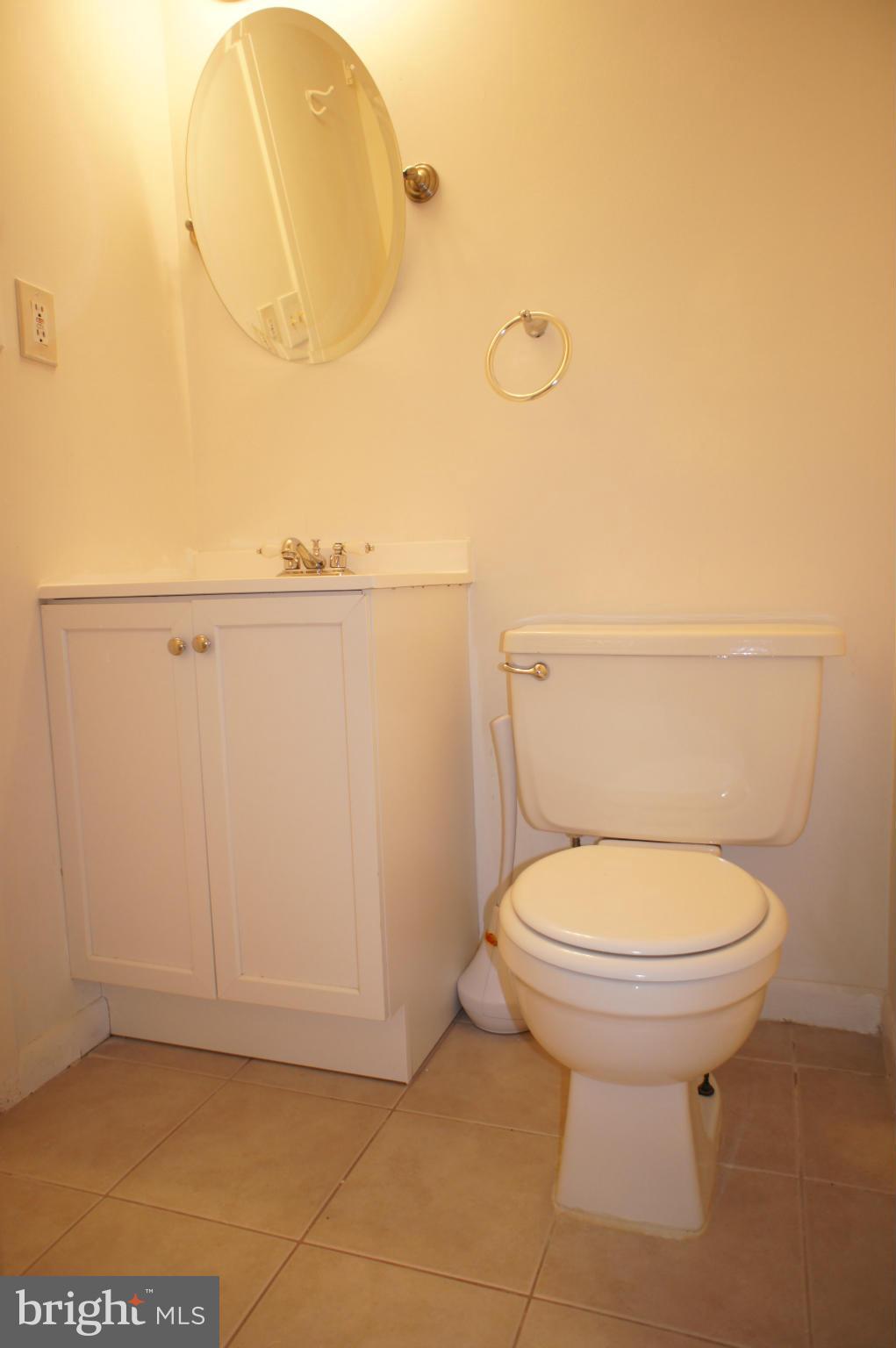 2220 Castle Rock Square, Unit 12C Reston, VA 20191 - Photo 9 of 16 a bathroom with a toilet and a sink
