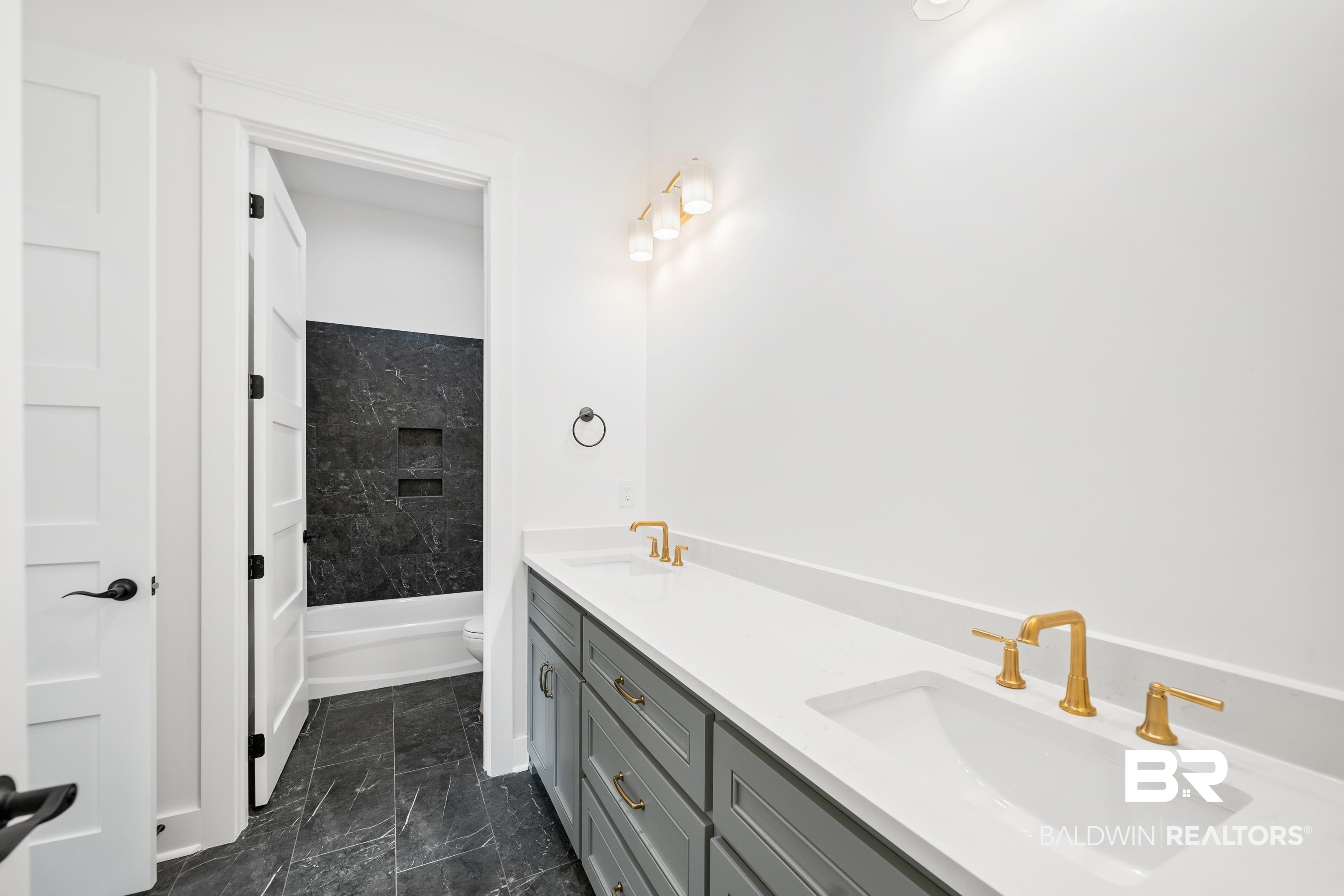 12453 County Road 1 Fairhope, AL 36532 - Photo 23 of 33 Full bathroom with tiled shower / bath, vanity, and toilet